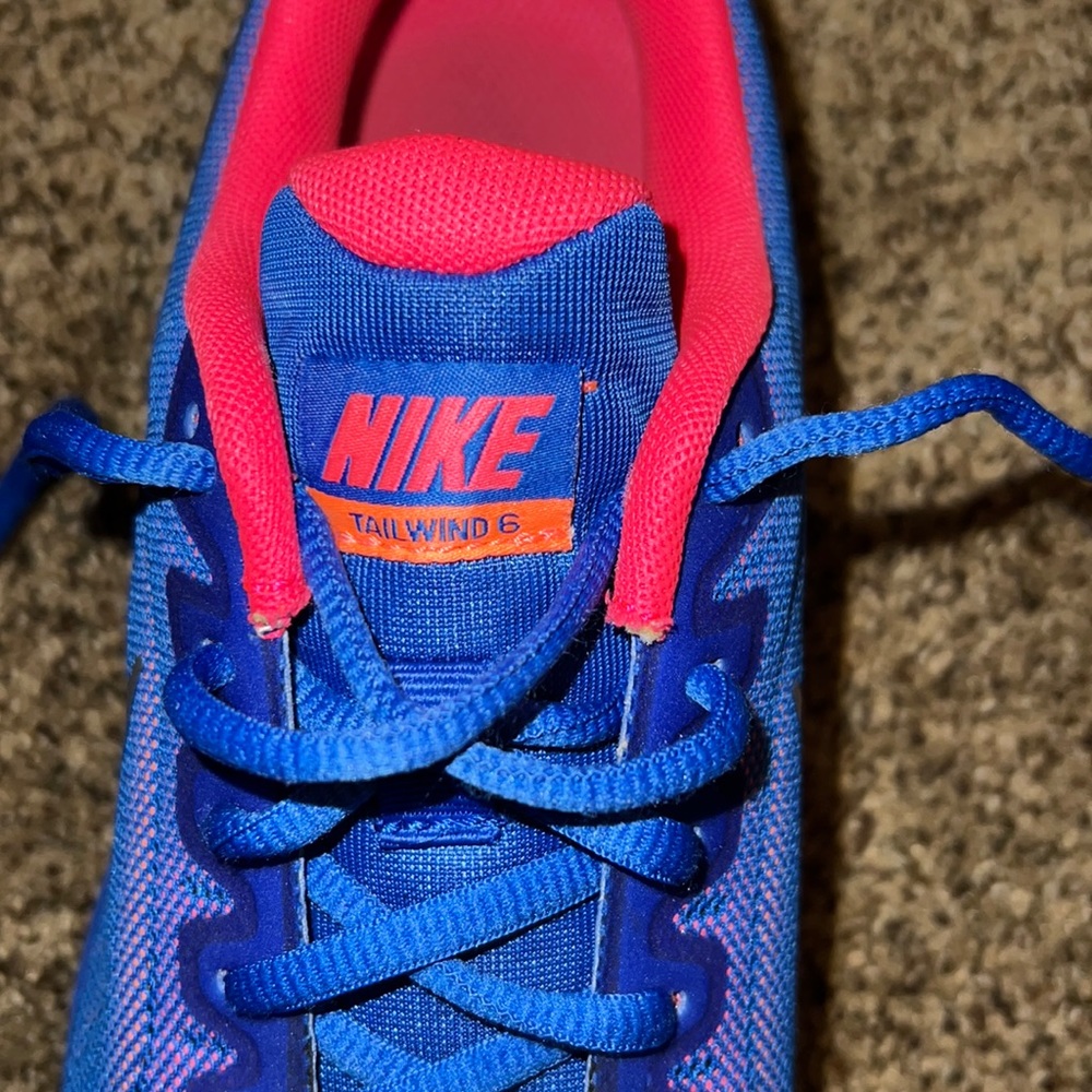 Nike Tail Wind 6 shoes and color is bright blue with orange and pink accents. - Picture 2 of 2